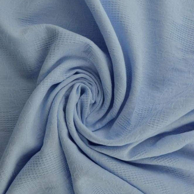 Lyseblå bomulds jacquard - vaffelstruktur med blomstermotiv, metervare til erhverv (billede 1 af 5)
