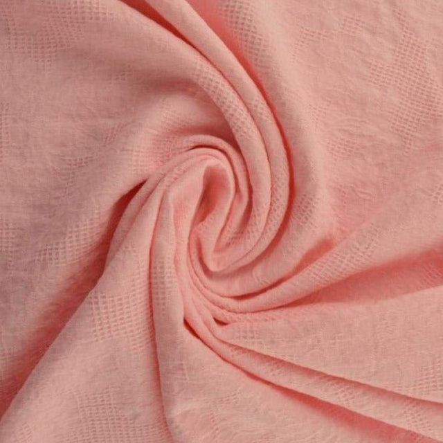 Lyserød bomulds jacquard - vaffelstruktur med blomstermotiv, metervare til erhverv (billede 1 af 5)