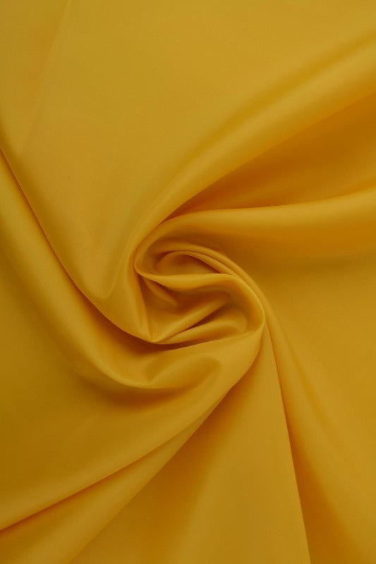 Sennepsgul polyester foer – glat, let & let glans, metervare til erhverv (billede 1 af 5)