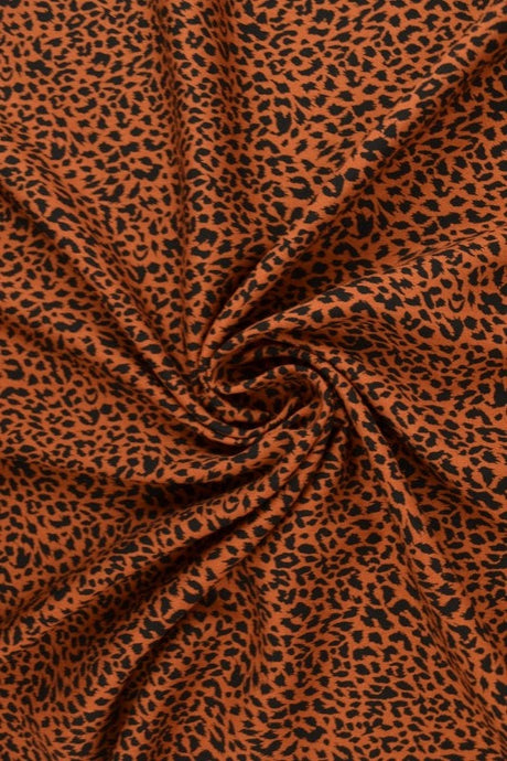 Viskose stof med mini leopardprint – kobber & sort, metervare til erhverv (billede 1 af 9)